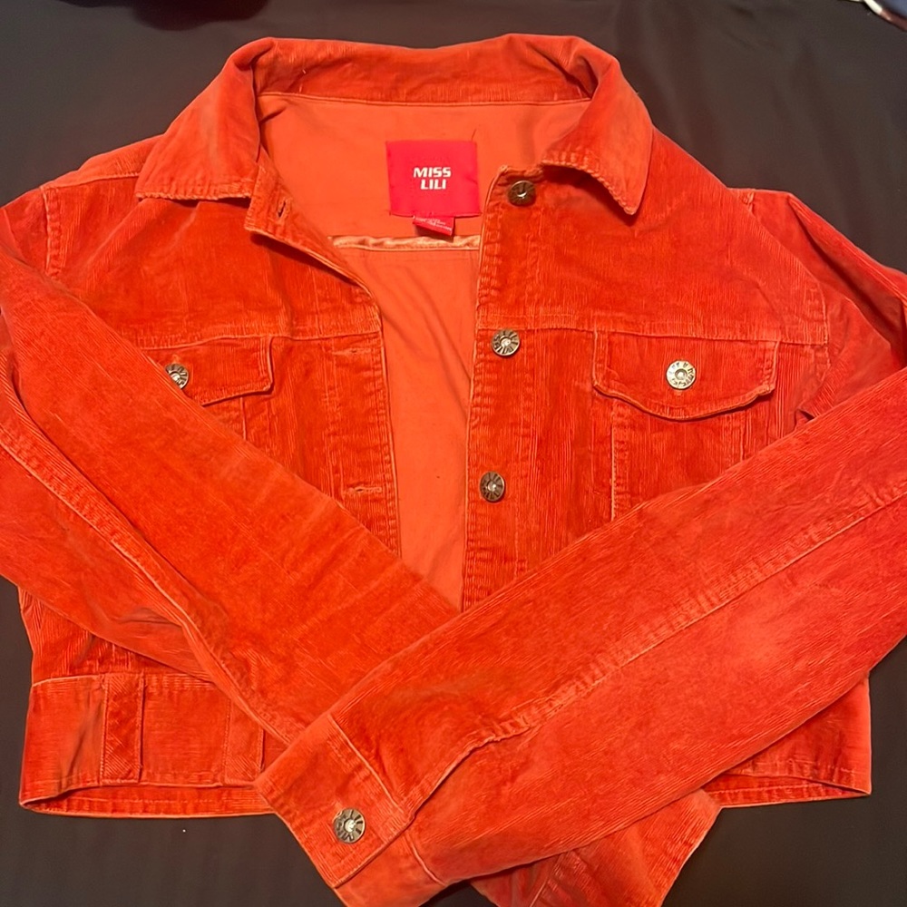 I’m selling an orange Jean jacket and it’s only been worn one time.